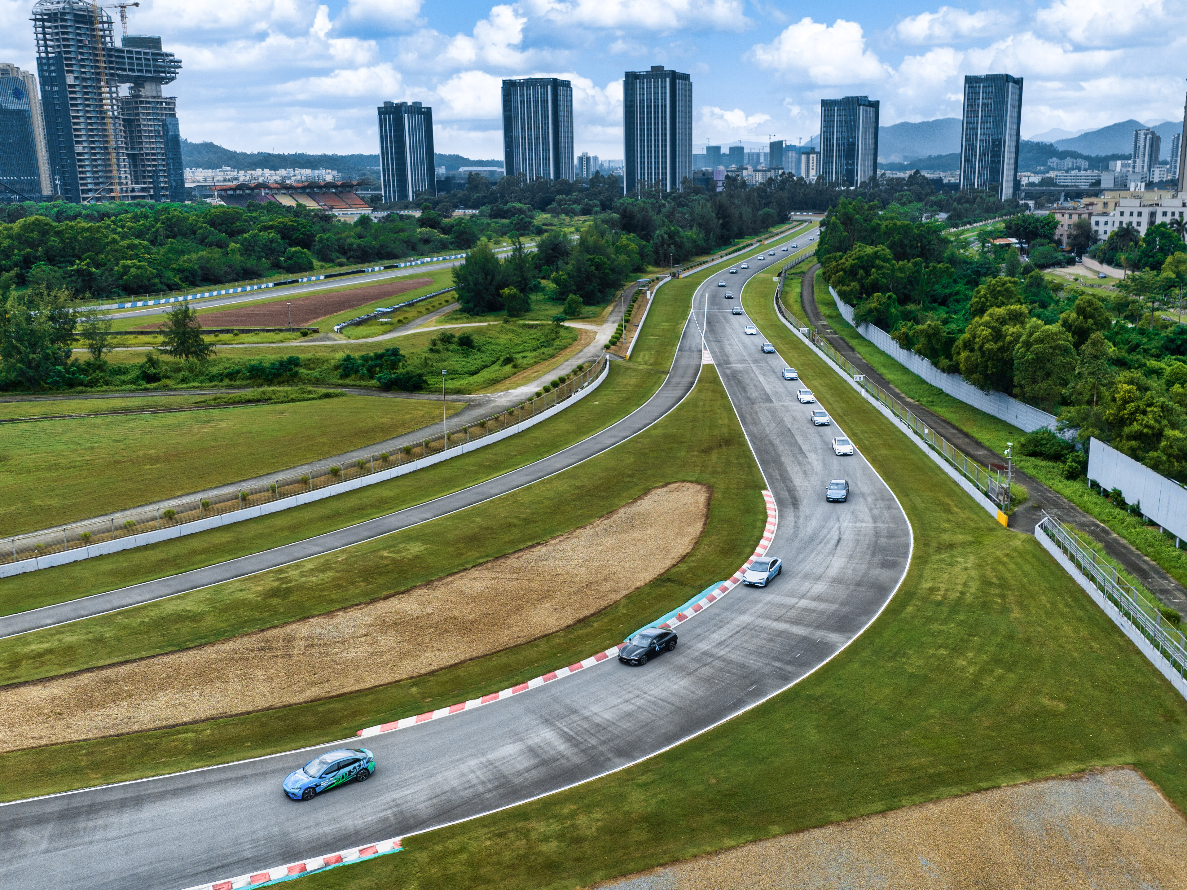 100 HK prospective car owners cruising on the race track